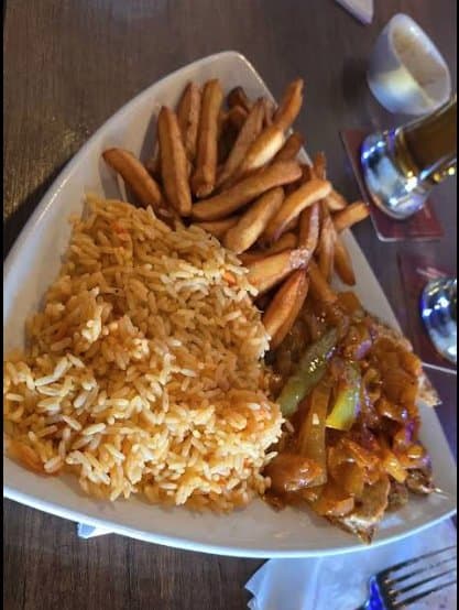 Portuguese chicken plate with rice and fries